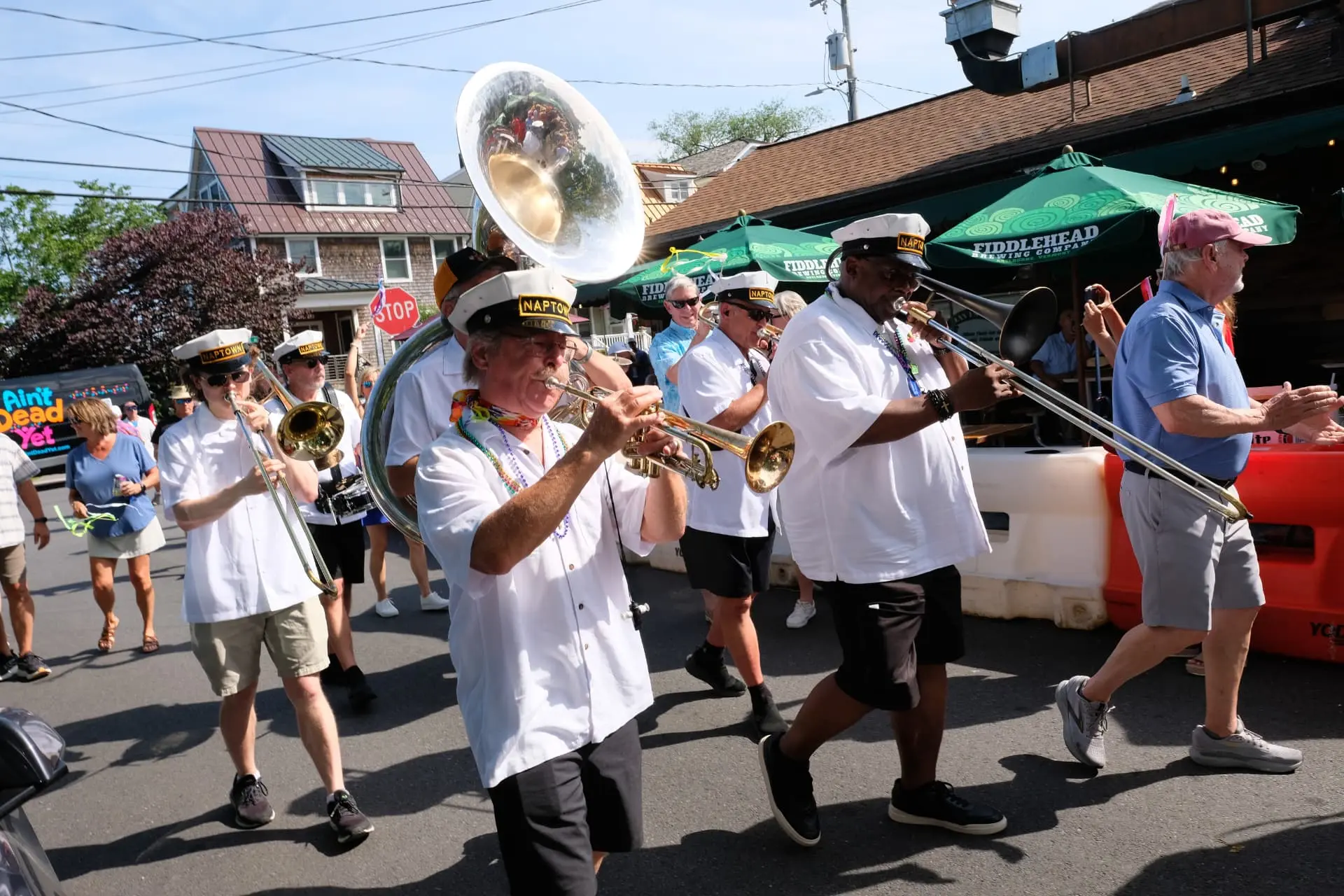 A New Orleans-style brass band marching in an ADY Thriver Parade